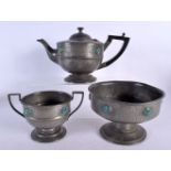 AN ART DECO CASHBERRY PEWTER AND RUSKIN ENAMEL TEASET. Largest 26 cm wide. (3)