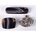 TWO AGATE BROOCHES AND ANOTHER. Largest 6.4cm x 1.8cm (3)