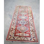 A Caucasian long rug 192 x 85 cm.