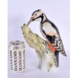 AN UNUSUAL LARGE KPM BERLIN PORCELAIN FIGURE OF A BIRD modelled upon a stump. 25 cm x 16 cm.