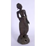 AN ANTIQUE MIDDLE EASTERN ASIAN BRONZE FIGURE OF A DEITY. 22 cm high.