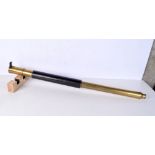A vintage leather and brass telescope. 97cm extended length.