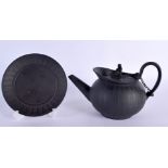 A 19TH CENTURY WEDGWOOD BLACK BASALT TEAPOT ON STAND with figural finial. 20 cm wide. (2)