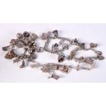 FOUR SILVER CHARM BRACELETS. Total weight 198.3g (4)