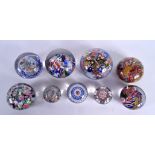 A GROUP OF NINE ANTIQUE GLASS PAPERWEIGHTS including Baccarat & Clichy. Largest 8.5 cm diameter. (9)