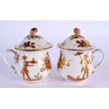 AN UNUSUAL PAIR OF 19TH CENTURY CONTINENTAL PORCELAIN CUSTARD CUPS AND COVERS painted with unusual C