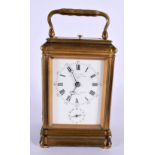 AN ANTIQUE PETIT SONNERIE REPEATING BRASS CARRIAGE CLOCK. 16 cm high including handle.