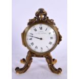 A MID 19TH CENTURY FRENCH GILT BRONZE MINIATURE MANTEL CLOCK upon scrolling feet. 15 cm x 8 cm.