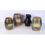 A collection of large glazed pottery kitchen storage pots titled with 'flour' and 'sugar', together