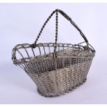 AN EARLY 20TH CENTURY SILVER WIRE BOTTLE HOLDER with twist handle. 22 cm x 22 cm.