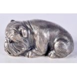 A CONTINENTAL SILVER MODEL OF A DOG WITH GEM SET EYES. Stamped 84, 3.1cm x 6.3cm x 3.6cm, weight 60