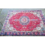 A large Persian rug 327 x 244 cm