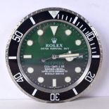 A ROLEX SHOP DISPLAY ADVERTISING WALL CLOCK. 33 cm diameter.