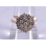 AN 18CT GOLD AND DIAMOND CLUSTER RING.  Stamped 18K, Size R, weight 4.9g