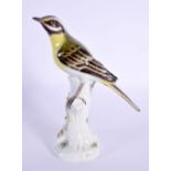 A FINE MEISSEN PORCELAIN FIGURE OF A BIRD modelled upon a stump. 18 cm x 8 cm.