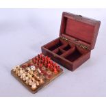 A MINIATURE 19TH CENTURY CARVED AND STAINED BONE TRAVELLING CHESS SET. Largest 2 cm high. (qty)