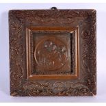 A 19TH CENTURY EUROPEAN BRONZE MADONNA AND CHILD PLAQUE within a giltwood frame. 26 cm square.