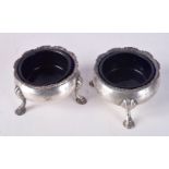 A PAIR OF VICTORIAN SILVER SALTS WITH BLUE GLASS LINERS. Hallmarked London 1840. 4cm x 6.2cm, weig