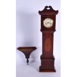 A MINIATURE LONGCASE CLOCK. 55 cm x 7 cm.