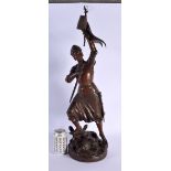 AN ANTIQUE FRENCH BRONZE OF JOAN OF ARC modelled holding aloft a flag. 64 cm high.