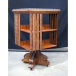 A Mid Century carved wood revolving bookcase