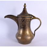 AN EARLY MIDDLE EASTERN TURKISH BRASS COFFEE POT. 27 cm x 20 cm.