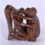 A JAPANESE CARVED WOOD EROTIC NETSUKE. 4.5 cm x 4.25 cm.