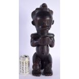 A LARGE AFRICAN TRIBAL CARVED WOOD FIGURE modelled as a female holding a bowl. 42 cm x 12 cm.