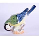 A FINE MEISSEN PORCELAIN FIGURE OF A BIRD modelled pecking. 9 cm x 9 cm.