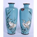 A PAIR OF 19TH CENTURY JAPANESE MEIJI PERIOD CLOISONNE ENAMEL VASES decorated with birds. 15 cm high