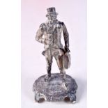 A CONTEMPORARY SILVER FIGURE OF AN EDWARDIAN GENTLEMAN. Hallmarked London 1975, 6.6cm x 3.1cm x 3.1