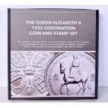 A Queen Elizabeth II 1953 Coronation coin and stamp set .