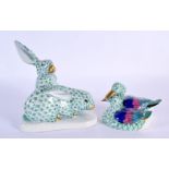 A HEREND PORCELAIN FIGURE OF TWO RABBITS together with a smaller duck group. Largest 15 cm x 11 cm.