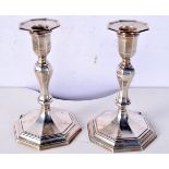 A PAIR OF SILVER WEIGHTED CANDLESTICKS. Hallmarked Sheffield 1924, 17cm x 10cm, total weight 777g