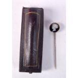 A CASED CAMEO STICK PIN. 7.8cm x 1.7cm, weight 3.7g