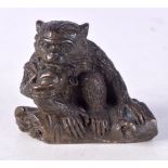 A BRONZE MODEL OF A MONKEY. 4.7cm x 5.8cm x 3.4cm