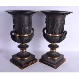 A LARGE PAIR OF CONTEMPORARY TWIN HANDLED BRONZE VASES decorated with classical figures, upon bluejo