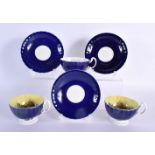 A RARE SET OF THREE AYNSLEY BLUE AND YELLOW CUPS AND SAUCERS by Bailey, decorated with bold foliage.