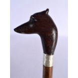 AN EARLY 20TH CENTURY BAVARIAN BLACK FOREST CARVED WOOD WALKING CANE with dog head terminal. 90 cm l