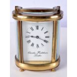 CHARLES FRODSHAM BRASS CARRIAGE CLOCK OF OVAL FORM, with certificate of authenticity dated December