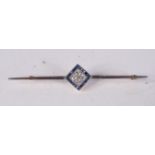 AN ANTIQUE GOLD BAR BROOCH MOUNTED WITH DIAMONDS AND SAPPHIRES IN A FITTED CASE. 7cm x 1.3cm, weigh