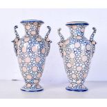 A pair of Continental small twin handled vases 16.5 cm (2)