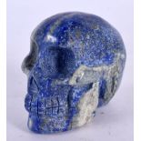 A CHINESE CARVED LAPIS LAZULI SKULL. 7 cm x 6 cm.