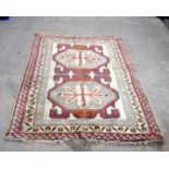 A Caucasian wool rug 180 x 128 cm