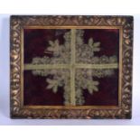 A FRAMED 18TH CENTURY EUROPEAN SILK EMBROIDERED RELIQUARY PANEL. 32 cm x 27 cm.