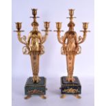 A LARGE PAIR OF CONTEMPORARY BRONZE AND MARBLE CANDLESTICK. 42 cm x 12 cm.