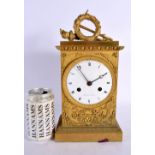 AN EARLY 19TH CENTURY FRENCH ORMOLU EMPIRE CLOCK decorated with motifs. 30 cm x 12 cm.