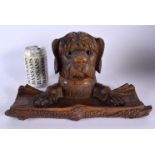 A LARGE 19TH CENTURY BAVARIAN BLACK FOREST CARVED WOOD INKWELL formed as a seated hound. 28 cm x 18