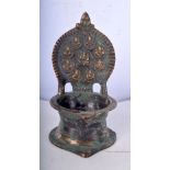 A small brass Indian oil lamp with Laxmi decoration 11x 6 cm.