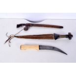 A collection of daggers, including a bone handled South East Asian dagger, a Kris dagger and another